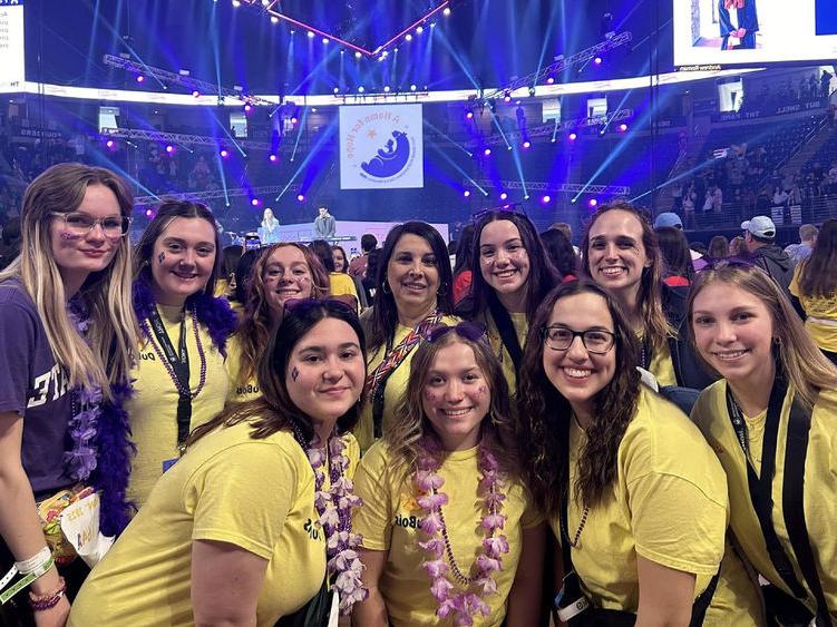 Representatives from Penn State DuBois, including this year’s THON dancers from the campus, gather on the dance floor at the Bryce Jordan Center during THON 2025.